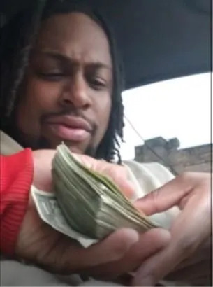 Footage shows former Philadelphia Sheriff's deputy Samir Ahmad counting cash following the sale of two guns to a confidential FBI informant on Oct. 13, 2022, according to prosecutors.&nbsp; / Credit: U.S. District Court for the Eastern District of Pennsylvania