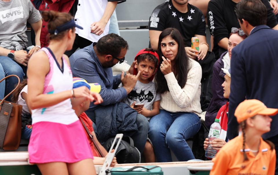 The match Umpire and Irina-Camelia Begu of Romania check on a child that was struck in the face - GETTY IMAGES