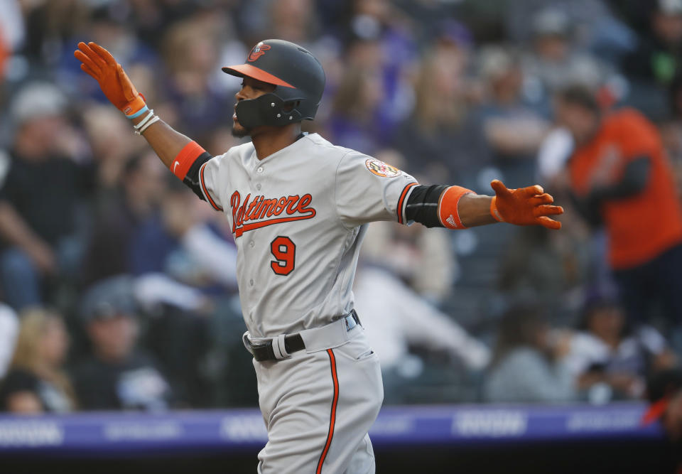 Baltimore Orioles' Keon Broxton celebrates his two-run home run off Colorado Rockies starting pitcher Jeff Hoffman in the second inning of a baseball game Friday, May 24, 2019, in Denver. (AP Photo/David Zalubowski)