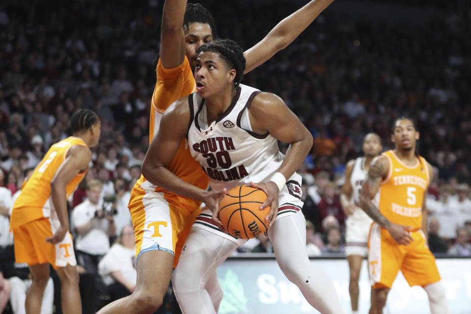 South Carolina forward Collin Murray-Boyles (30) makes a move to the basket against Tennessee forward Jonas Aidoo during the first half of an NCAA college basketball game Wednesday, March 6, 2024, in Columbia, S.C. (AP Photo/Artie Walker Jr.)