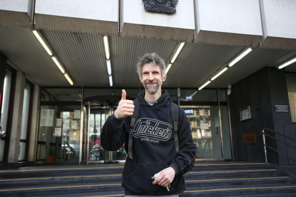 Larch Maxey, an anti-HS2 activist evicted from the network of tunnels beneath Euston Square Gardens, gives a thumbs up as he leaves Highbury Magistrates' CourtPA