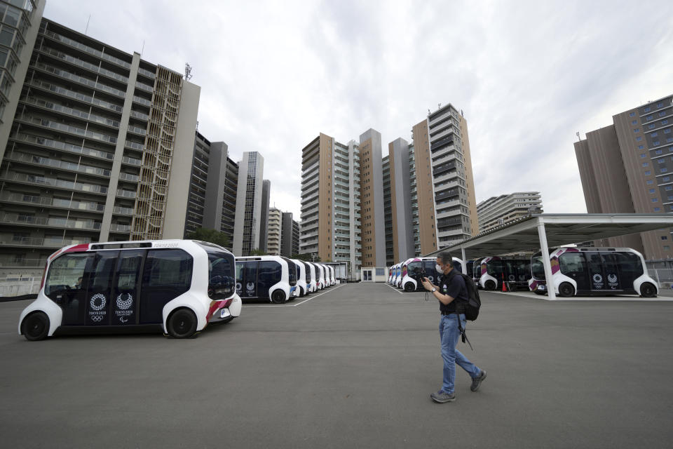 Autonomous electric vehicles which will be used around the main facilities, are seen during a press tour of the Tokyo 2020 Olympic and Paralympic Village Sunday, June 20, 2021, in Tokyo. (AP Photo/Eugene Hoshiko)