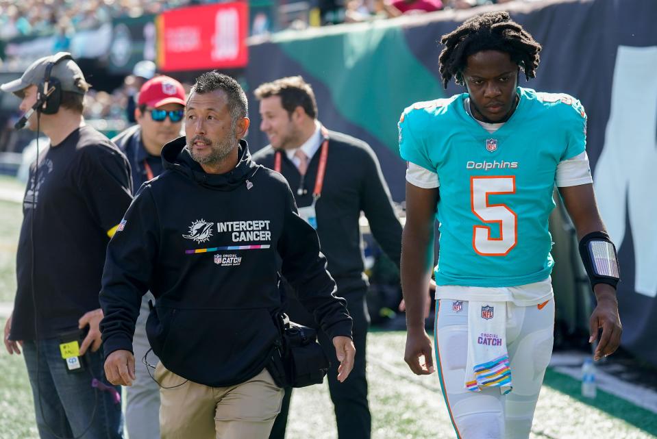 Miami Dolphins quarterback Teddy Bridgewater leaves the field after taking a hit from the New York Jets during the first quarter.