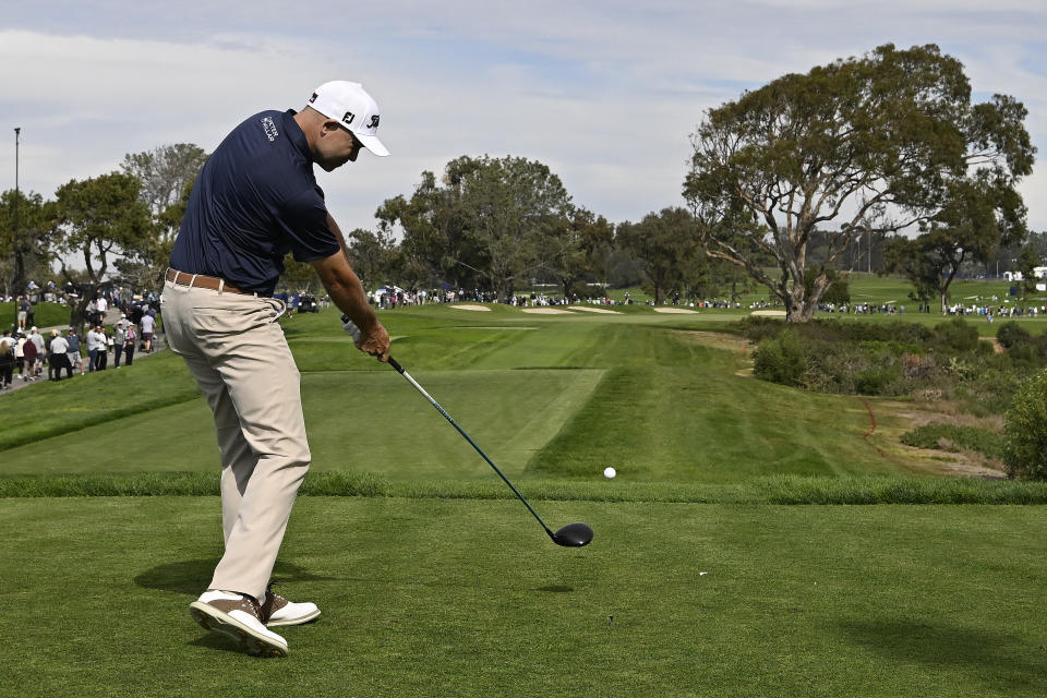 Bill Haas hits his tee shot on the sixth hole of the South Course during the third round of the Farmers Insurance Open golf tournament, Friday, Jan. 28, 2022, in San Diego. (AP Photo/Denis Poroy)