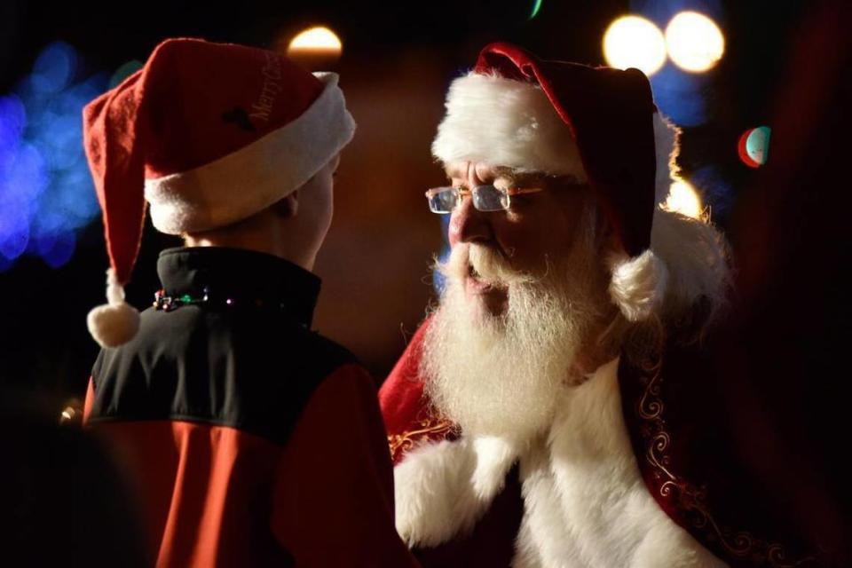 Noah Shreve, 7, of Fort Mill greets Santa Thursday night at the Fort Mill Christmas Tree Lighting.