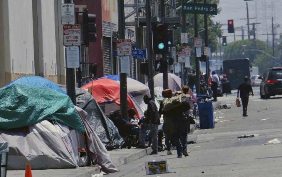 Homeless camps line a street in downtown Los Angeles.
