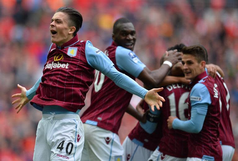 Aston Villa's Jack Grealish celebrates Villa's second goal during the FA Cup semi-final against Liverpool at Wembley stadium on April 19, 2015