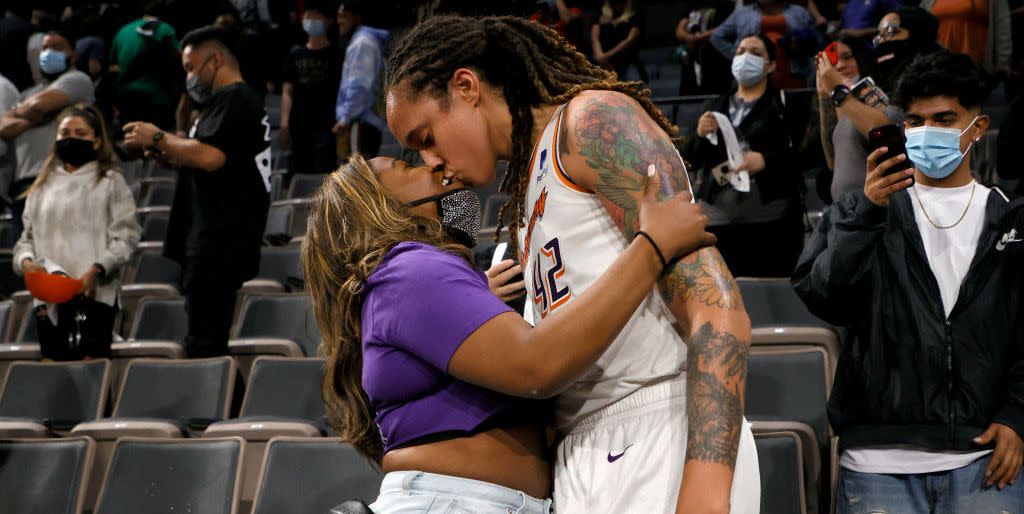 las vegas, nevada   october 08  brittney griner 42 of the phoenix mercury kisses her wife cherelle griner in the stands after the mercury defeated the las vegas aces 87 84 in game five of the 2021 wnba playoffs semifinals to win the series at michelob ultra arena on october 8, 2021 in las vegas, nevada note to user user expressly acknowledges and agrees that, by downloading and or using this photograph, user is consenting to the terms and conditions of the getty images license agreement  photo by ethan millergetty images