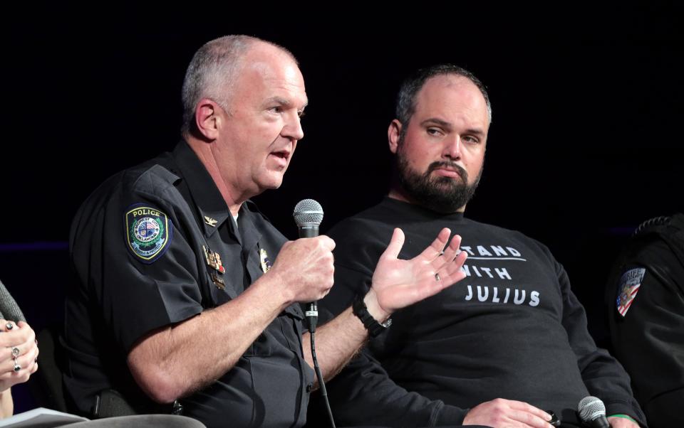 Midwest City Police Chief Sid Porter speaks as police and community leaders meet Sunday for a community forum at Tower Theatre. At right is Jess Eddy, co-director of LiveFree OKC.