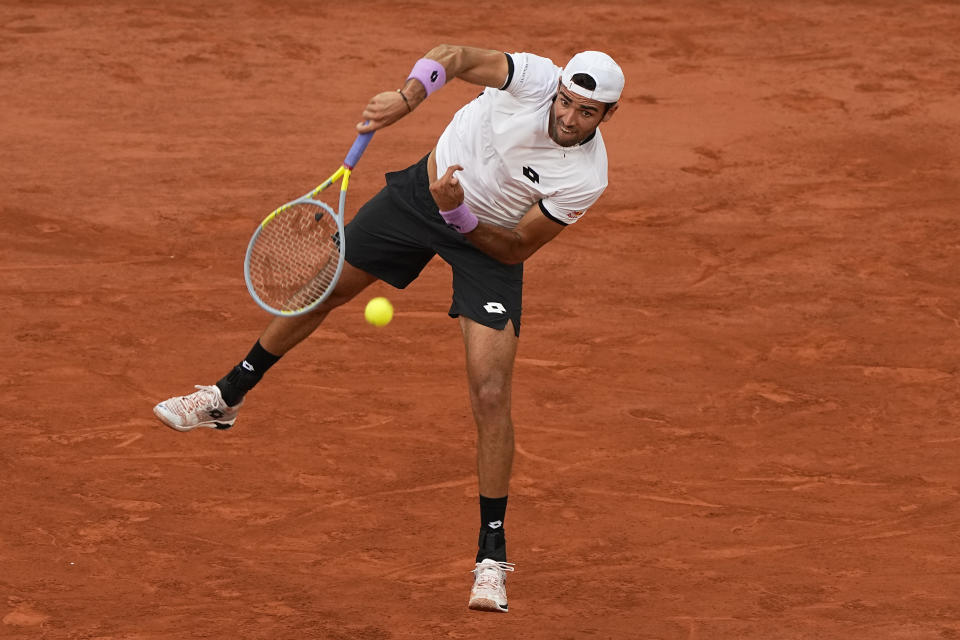 Italy's Matteo Berrettini serves the ball as he plays Serbia's Novak Djokovic during their quarterfinal match of the French Open tennis tournament at the Roland Garros stadium Wednesday, June 9, 2021 in Paris. (AP Photo/Michel Euler)