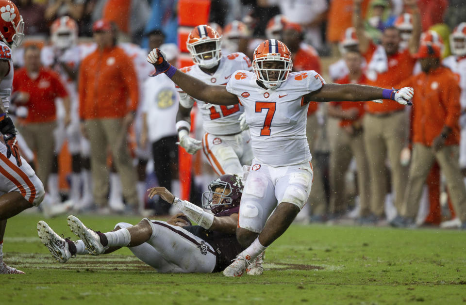 Clemson defensive end Austin Bryant (7) reacts after sacking Texas A&M quarterback Kellen Mond, bottom, during the first half of an NCAA college football game Saturday, Sept. 8, 2018, in College Station, Texas. (AP Photo/Sam Craft)