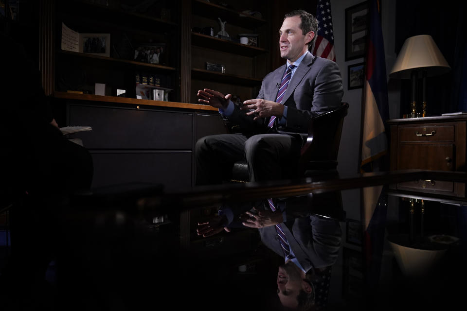 Rep. Jason Crow, D-Colo., talks during an interview with The Associated Press in his office on Capitol Hill in Washington, Wednesday, Dec. 15, 2021, looking back a year later at his experience during the Jan. 6 Capitol insurrection. (AP Photo/Susan Walsh)