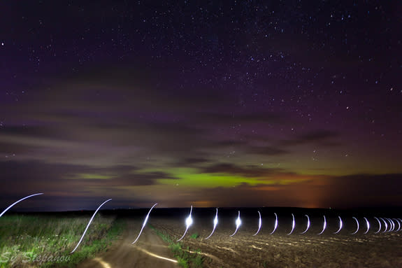 Astrophotographer Sy Stepanov took this shot of the auroral display resulting from the solar storm of July 14, 2012. The photo was taken above Lake Chelan, WA. Stepanov says the photo "is a little more creative. It involved myself running in a