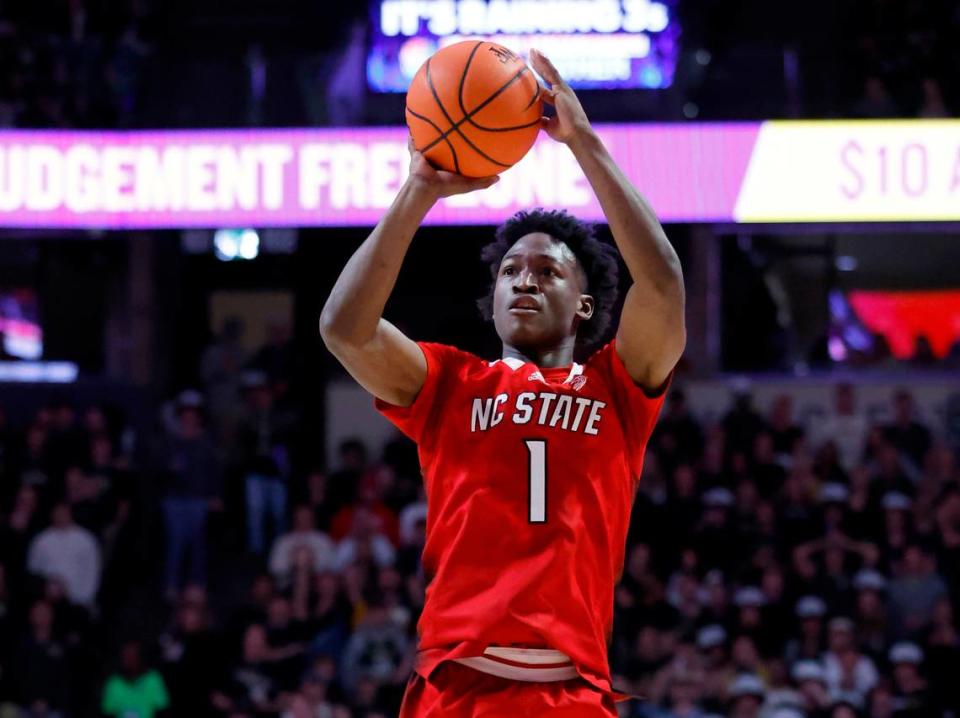 N.C. State’s Jarkel Joiner (1) makes a third-pointer at the end of the first half of N.C. State’s game against Wake Forest at Joel Coliseum in Winston-Salem, N.C., Saturday, Jan. 28, 2023.