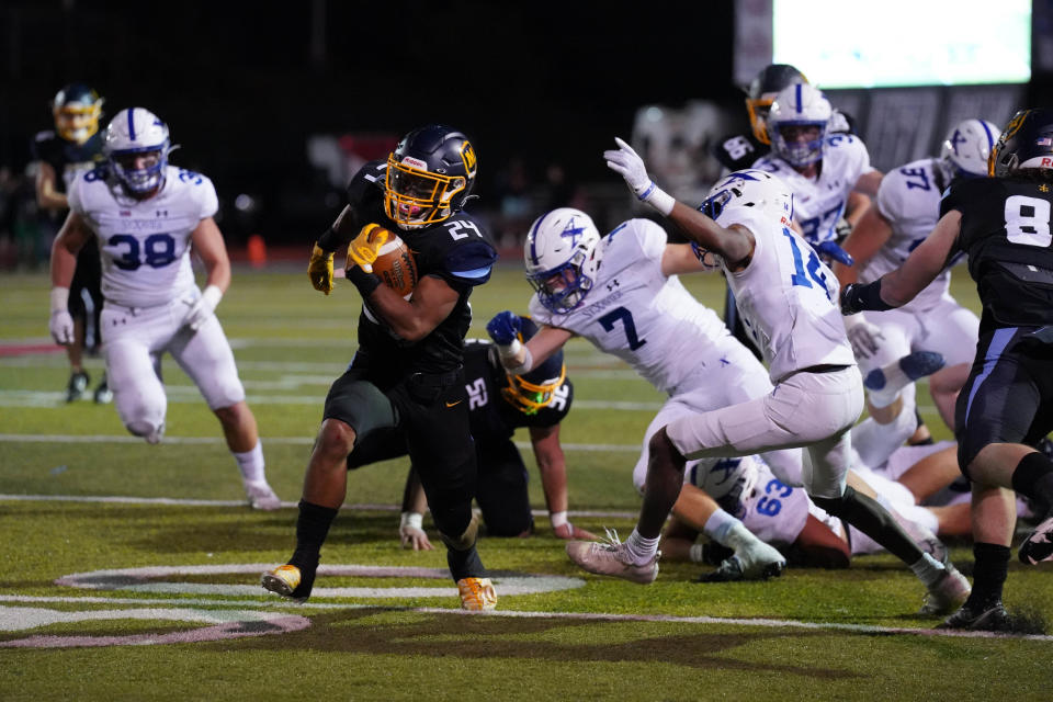 Moeller's Jordan Marshall makes another run during an OHSAA playoff game Friday, Nov. 4, 2022, at Norwood High School.