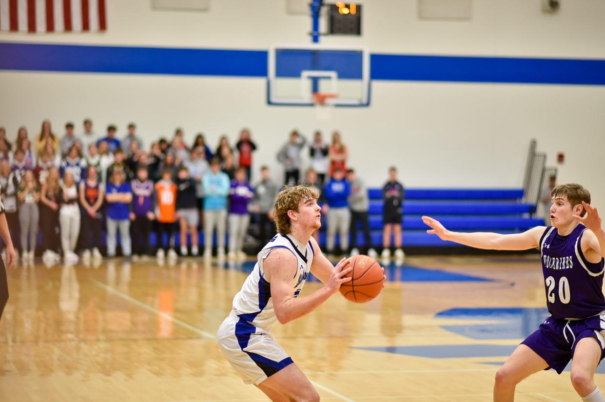 Van Meter's Carter Durflinger looks to shoot a three-pointer during the postseason opener against Nodaway Valley on Friday, Feb. 17, 2023.