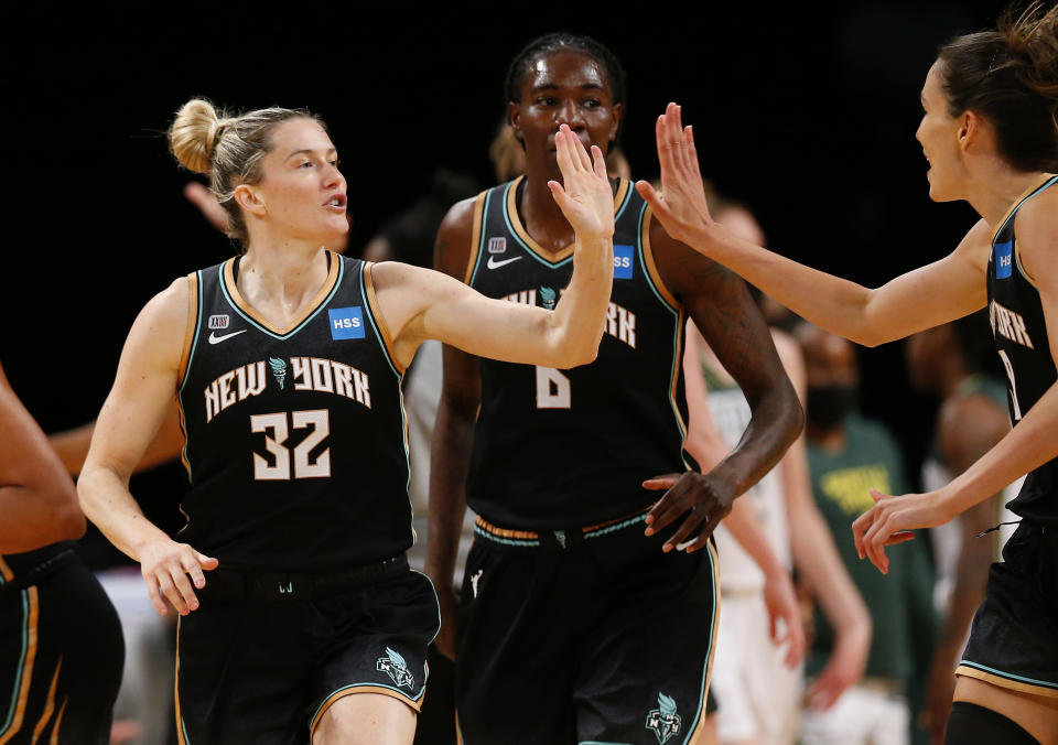 New York Liberty's Sami Whitcomb (32) reacts after making a 3-point shot against the Seattle Storm during the first half of a WNBA basketball game Friday, Aug. 20, 2021, in New York. (AP Photo/Noah K. Murray)