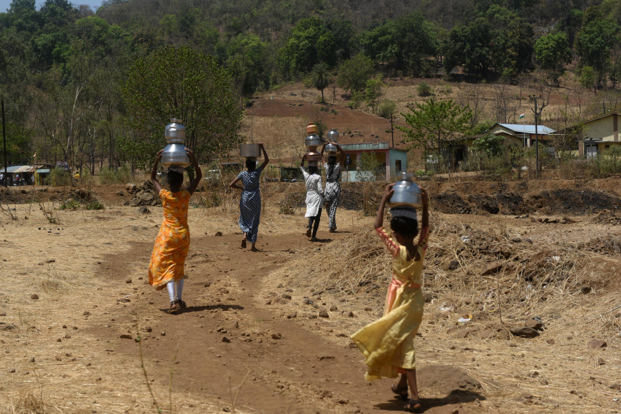 Villagers carry pots filled with water from a well during an ongoing heat wave in Kasara, India, May 1, 2024. / Credit: Indranil Aditya/NurPhoto/Getty