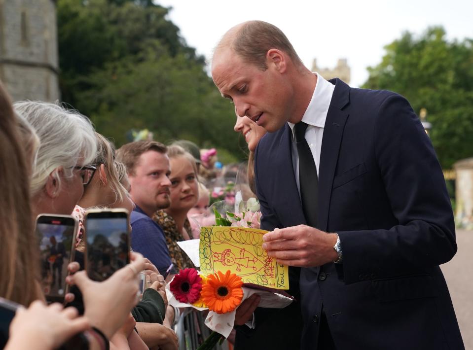 Prince William, Prince of Wales meets members of the public on the long Walk at Windsor Castle on September 10, 2022 in Windsor, England. Crowds have gathered and tributes left at the gates of Windsor Castle to Queen Elizabeth II, who died at Balmoral Castle on Sept. 8, 2022.