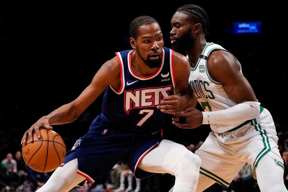 FILE - Brooklyn Nets forward Kevin Durant (7) drives against Boston Celtics guard Jaylen Brown, right, during the first half of Game 4 of an NBA basketball first-round playoff series April 25, 2022, in New York. Durant has again told Nets owner Joe Tsai that he wants to be traded, reiterating a request he first made nearly six weeks ago, a person with knowledge of the matter confirmed Monday, Aug. 8, 2022. (AP Photo/John Minchillo, File)