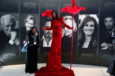 A woman poses at a cinema in Riyadh, Saudi Arabia April 18, 2018.  REUTERS/Faisal Al Nasser