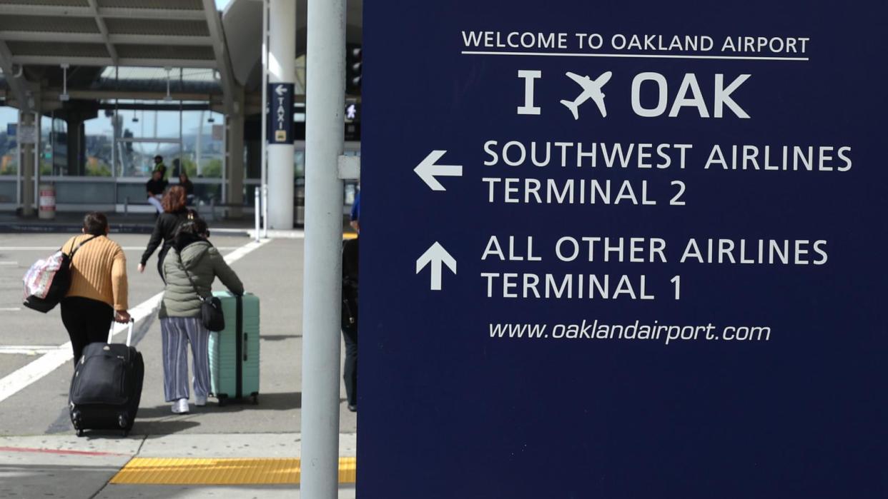 PHOTO: Travelers walk towards Terminal 1 at Oakland International Airport in Oakland, CA, April 12, 2024. (Justin Sullivan/Getty Images)