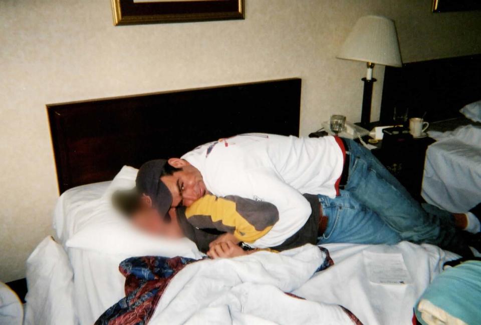 Kanakuk director Pete Newman, now serving multiple life sentences for child sex crimes, lies on top of a teen boy during an overnight trip in 2001.