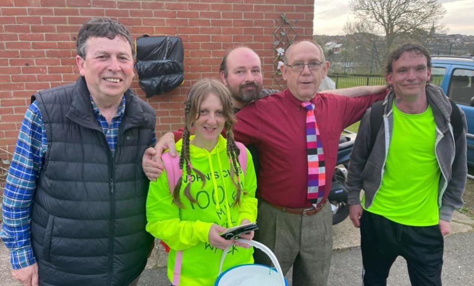 Isle of Wight County Press: Cllr Michael Lilley, Jo Smith and her father John Phillips, chair and founder of John's Club, alongside John's Club members