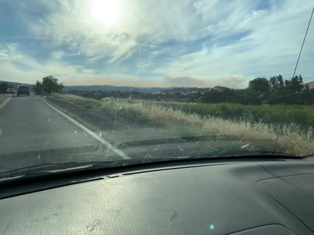 Smoke from the Sand Fire is seen from a distance in the Capay Valley in California