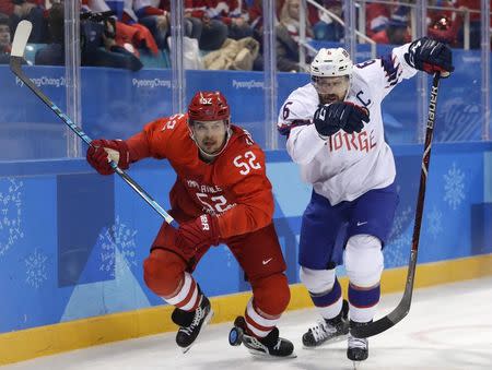 Ice Hockey - Pyeongchang 2018 Winter Olympics - Men's Quarterfinal Match - Olympic Athletes from Russia v Norway - Gangneung Hockey Centre, Gangneung, South Korea - February 21, 2018 - Sergei Shirokov, an Olympic Athlete from Russia, and Jonas Holos of Norway (R) in action. REUTERS/David W. Cerny