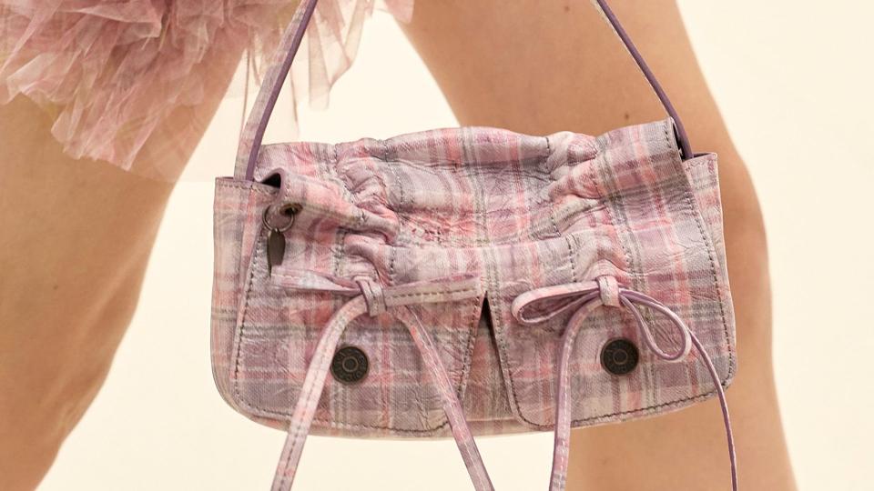 We love the checked print and bow details on this Acne Studios bag