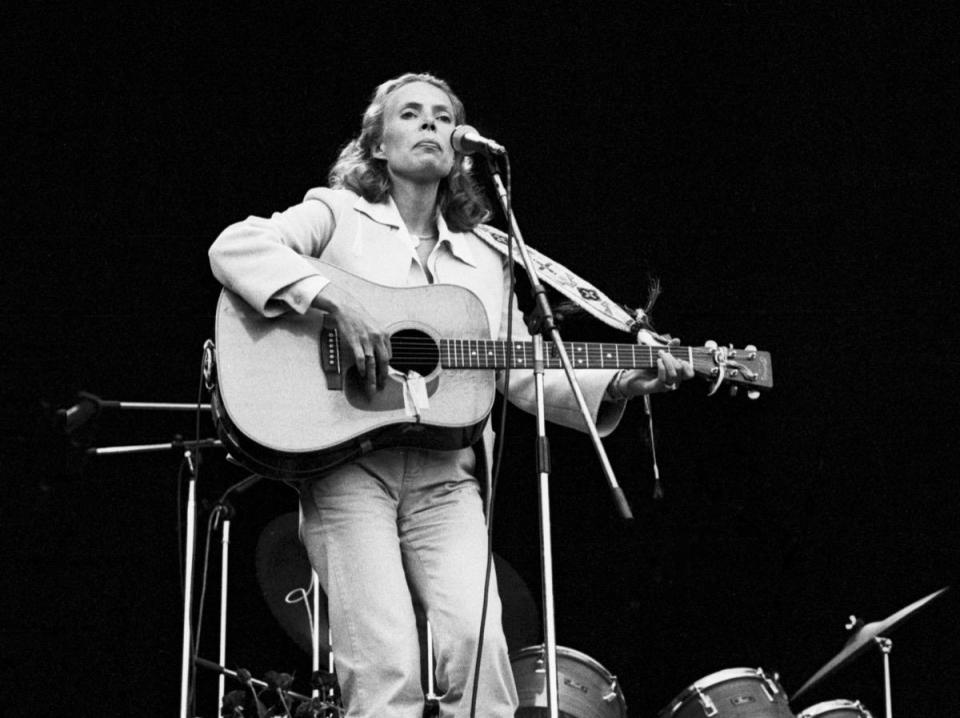 Joni Mitchell performs live on stage at Wembley Stadium, London.