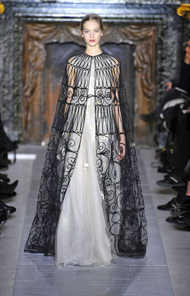 <b>Valentino SS13 </b><br><br>Full-length, nude dresses featured a black patterned overlay that fell to the floor.<br><br>© Rex