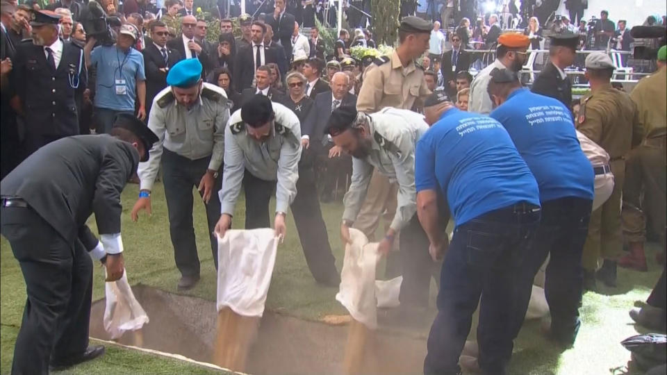 <p>A still image taken from a video shows personnel of the Israeli Defense Ministry pouring sand into the grave of former Israeli President Shimon Peres during his funeral ceremony at Mount Herzl Cemetery in Jerusalem on Sept. 30, 2016. (REUTERS/Pool via Reuters TV) </p>