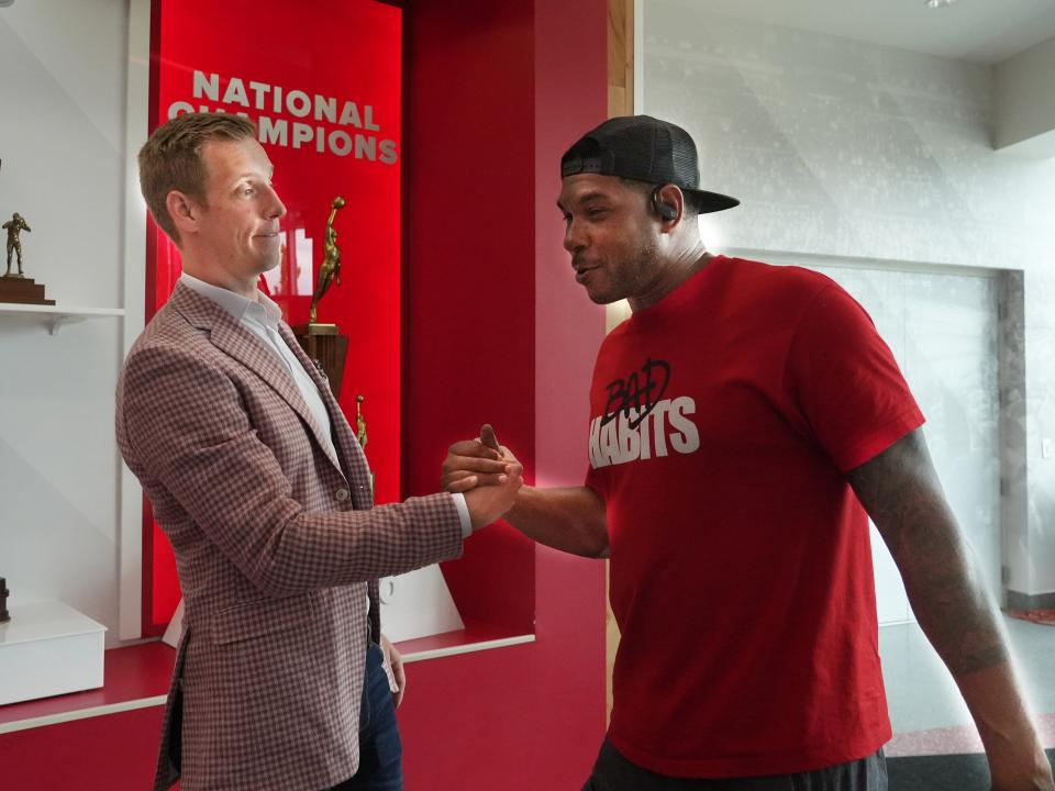 Jul 24, 2023; Columbus, Ohio. Former Ohio State men's basketball player Matt Terwilliger greets Leon Rogers in the Schottenstein Center. Since leaving basketball, Terwilliger is running his own wealth advisory company. 