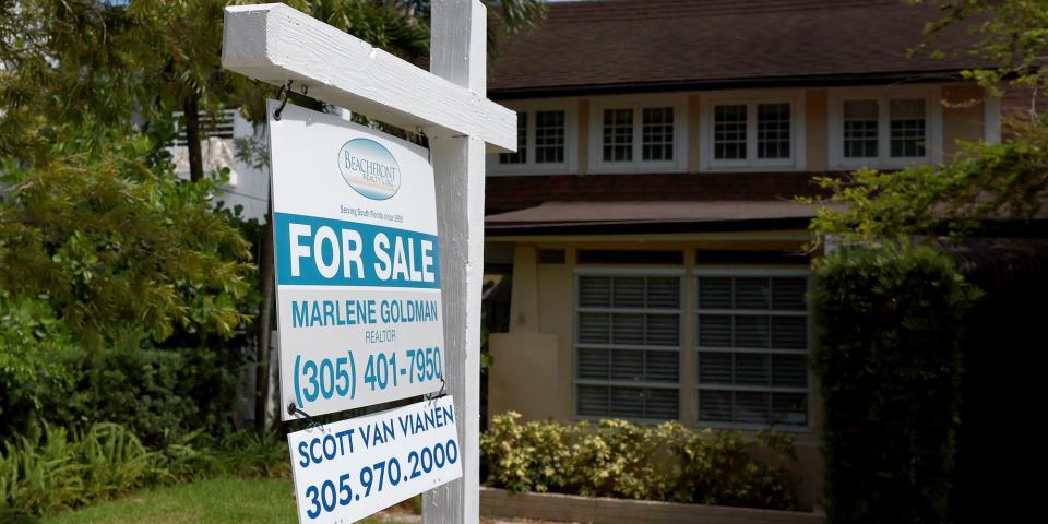 NOVEMBER9 home for sale with for sale sign in front of the door