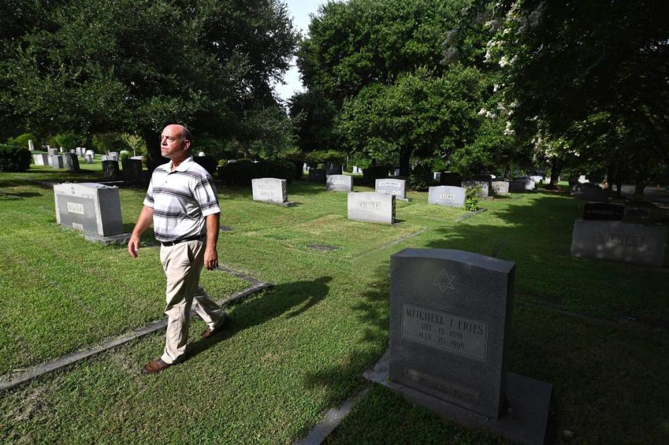 Brian Yesowitch, the Hilbert Fuerstman Historical Chairperson of the Hebrew Cemetery of Greater Charlotte, walks among the headstones on Friday, August 11, 2023.
