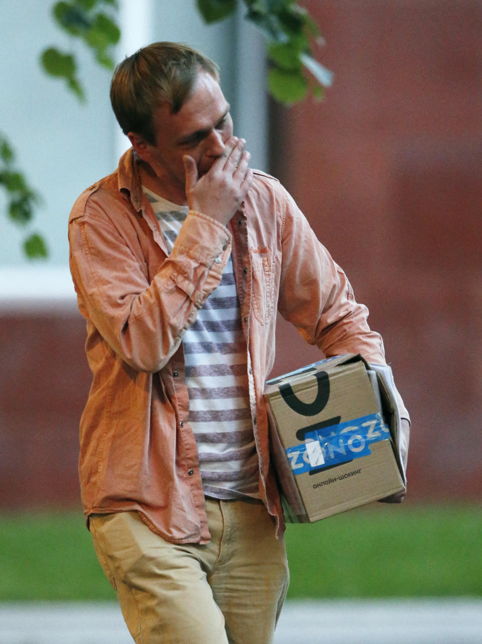 Prominent Russian investigative journalist Ivan Golunov, leaves a Investigative Committee building in Moscow, Russia, Tuesday, June 11, 2019. In a surprising turnaround, Russia's police chief on Tuesday dropped all charges against a prominent investigative reporter whose detention sparked public outrage and promised to go after the police officers who tried to frame the journalist as a drug-dealer. (AP Photo/Alexander Zemlianichenko)