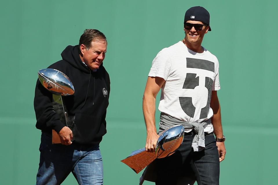 BOSTON, MA - APRIL 13:  New England Patriots head coach Bill Belichick and quarterback Tom Brady walk towards the pitchers mound at Fenway Park before the game between the Boston Red Sox and the Washington Nationals on April 13, 2015 in Boston, Massachusetts.  (Photo by Maddie Meyer/Getty Images)