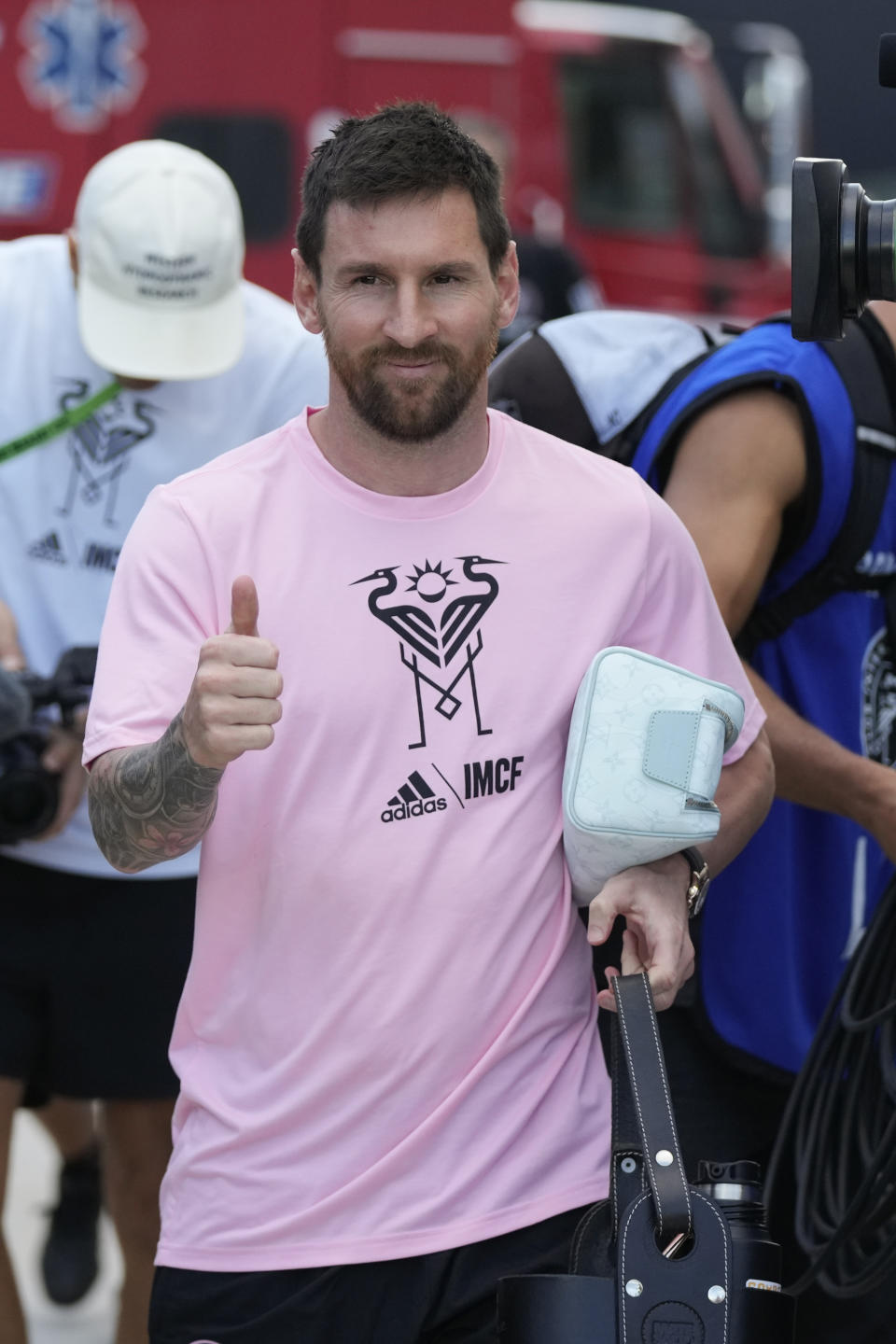 Inter Miami forward Lionel Messi gives a thumbs-up as he arrives ahead of an MLS soccer match against FC Cincinnati, Saturday, Oct. 7, 2023, in Fort Lauderdale, Fla. (AP Photo/Rebecca Blackwell)