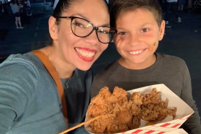 Pictured is Adan Llanos, 11, with mum Mirna. His sister was the one who found him dying.