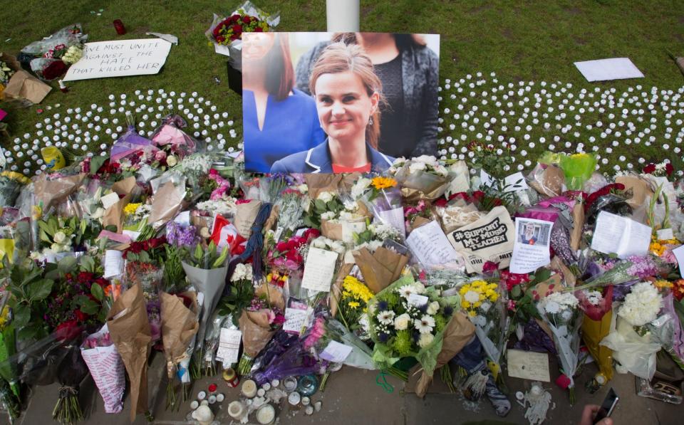 Flowers and tributes left outside parliament after the death of Jo Cox