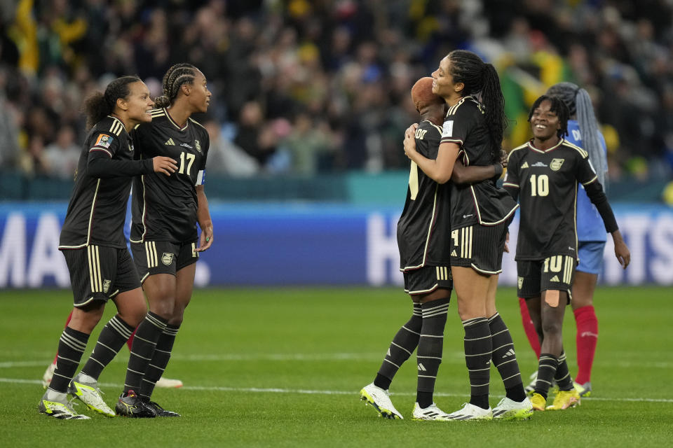 Jamaica's players celebrate at the end of the Women's World Cup Group F soccer match between France and Jamaica at the Sydney Football Stadium in Sydney, Australia, Sunday, July 23, 2023. The match ended in a 0-0 draw. (AP Photo/Rick Rycroft)