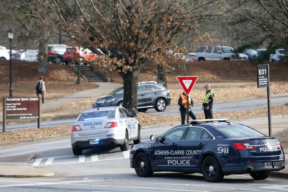 Athens-Clarke County police block traffic and investigate at the UGA intramural Fields after Laken Riley’s body was found on Thursday (AP)