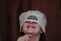 In this March 20, 2017 photo Carlone Schell from New York, smiles during The Argentine Experience in Buenos Aires, Argentina. Tourists participating in "The Argentine Experience" have the chance to learn about the local cuisine, wine and traditions during a dinner in Buenos Aires. (AP Photo/Natacha Pisarenko)