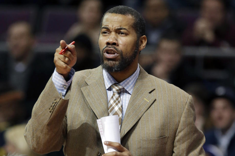 FILE - In this Feb. 24, 2014, file photo, Detroit Pistons assistant coach Rasheed Wallace directs players during the second half of an NBA basketball game against the Golden State Warriors in Auburn Hills, Mich. Memphis coach Penny Hardaway has added 16-year NBA veteran Rasheed Wallace as an assistant coach on a staff that also features former NBA coach Larry Brown. (AP Photo/Carlos Osorio, File)