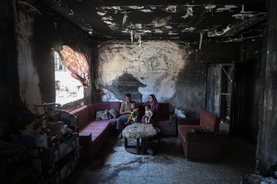 Muhammad Nabil Lulu lives with his wife and children in their destroyed home in the center of Khan Yunis town in the southern Gaza Strip, July 18, 2024.