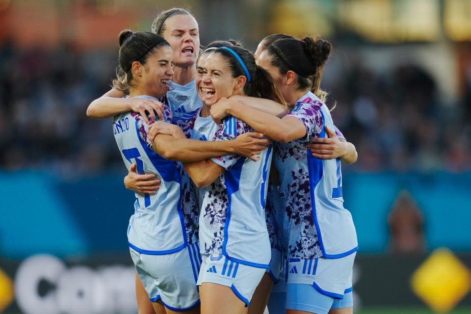 Aitana Bonmatí (center) celebrates with teammates after scoring a goal for Spain.