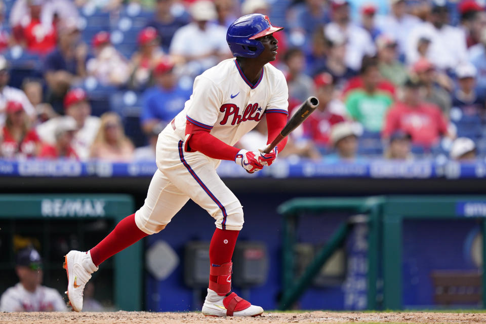 Philadelphia Phillies' Didi Gregorius follows through after hitting an RBI-sacrifice fly against Atlanta Braves pitcher Tyler Matzek during the sixth inning of a baseball game, Wednesday, July 27, 2022, in Philadelphia. (AP Photo/Matt Slocum)