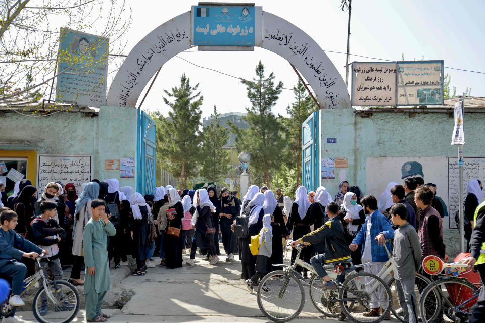 Image: Girls leave their school after attending only hours following reopening in Kabul on March 23, 2022. (Ahmad Sahel Arman / AFP - Getty Images)